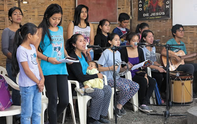 Isabel leads the singing at her chapel